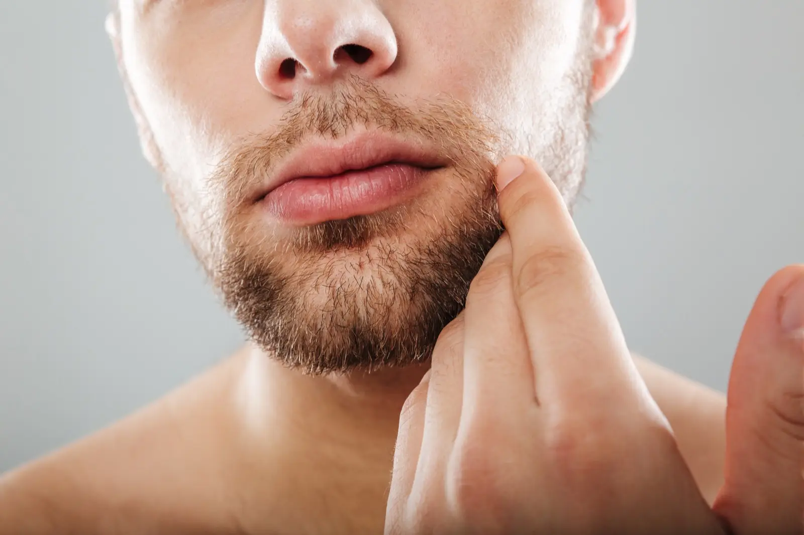 Close-up of a man’s lower face and full beard, illustrating beard density restoration